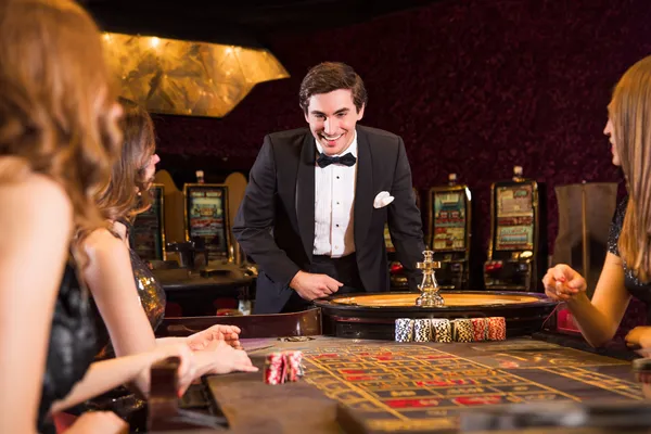 A stylish woman beside vibrant slot machines displaying glowing sevens, showcasing the variety of top slots at BIGPARI.