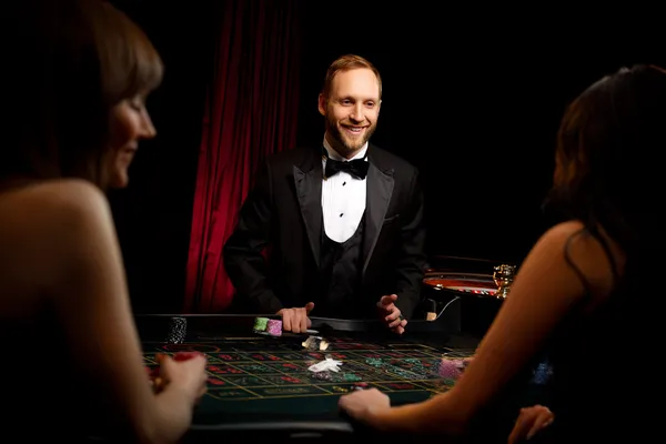 A player using their smartphone during a festive local event, representing BIGPARI’s fully mobile-friendly casino.
